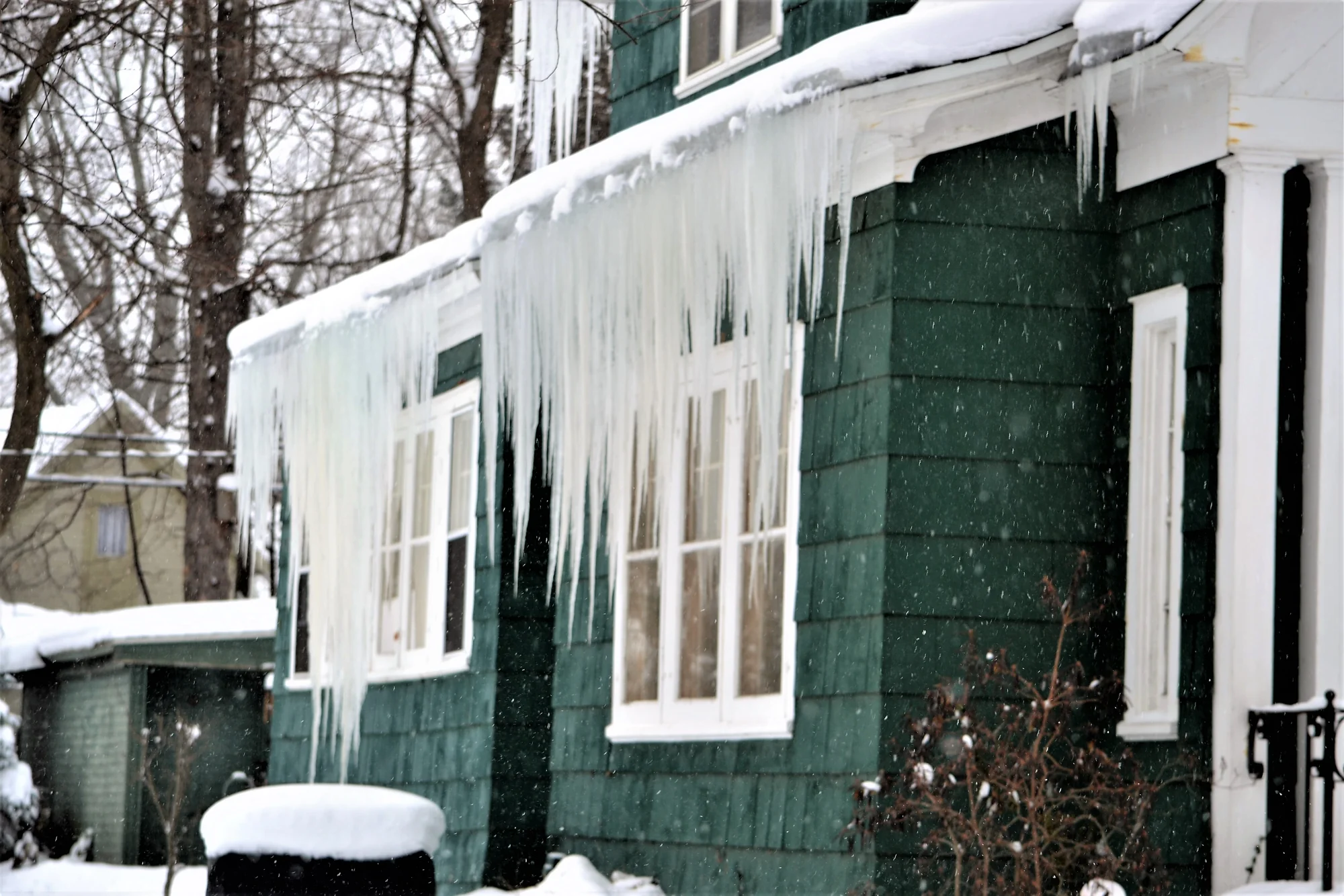 Heavy icicles and an ice dam on a home in Cottage Grove, MN